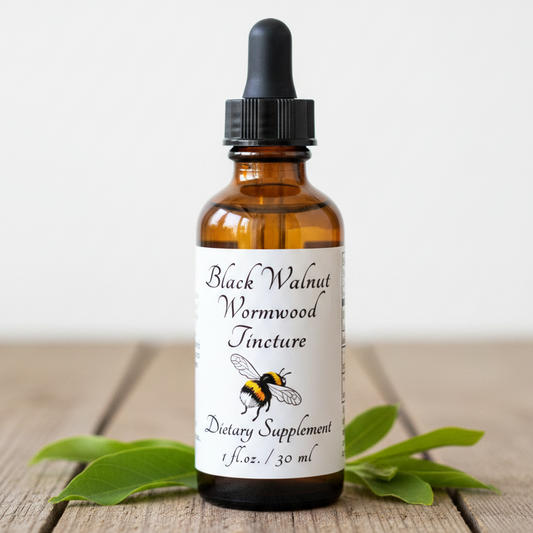 Label for Black Walnut Wormwood Tincture dietary supplement with bee illustration and text.