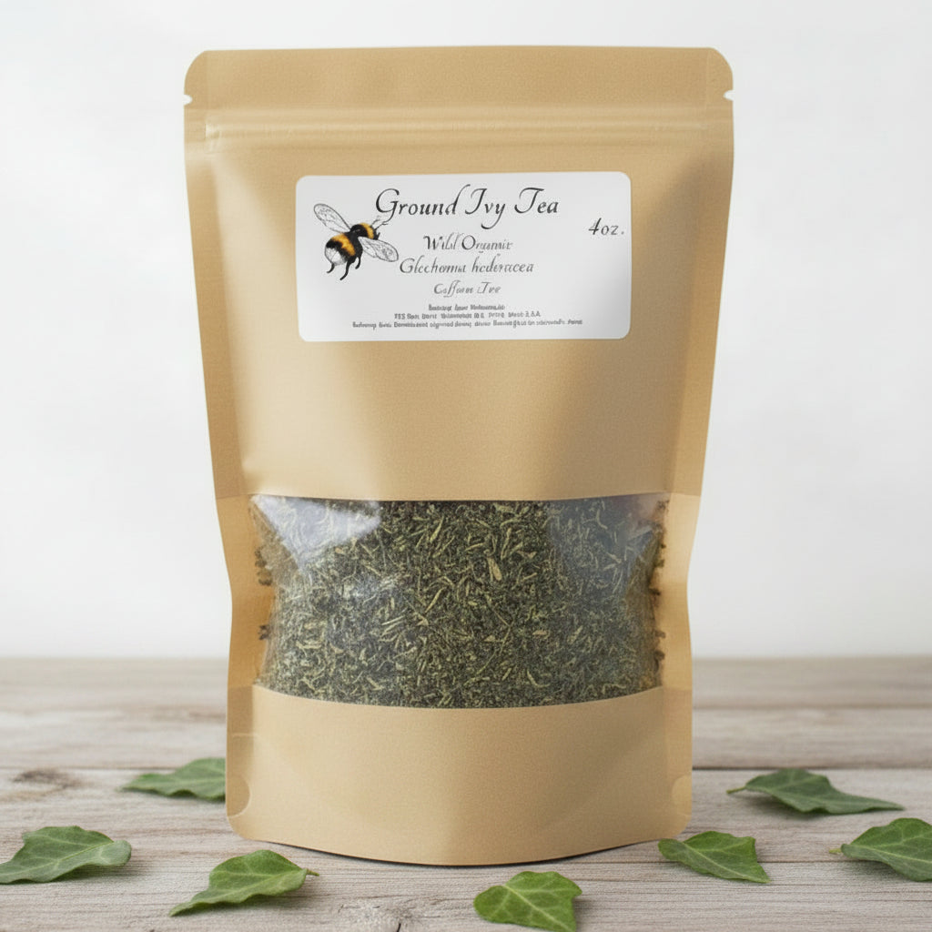 Ground Ivy tea package with green leaves on a wooden surface