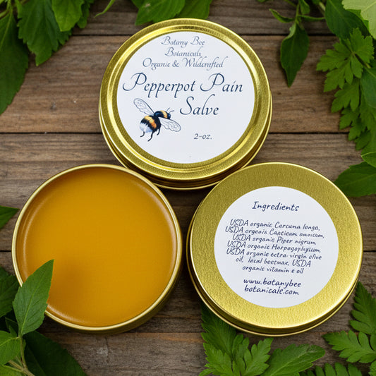 Open tin of Pepperpot Pain Salve with visible ingredients label 