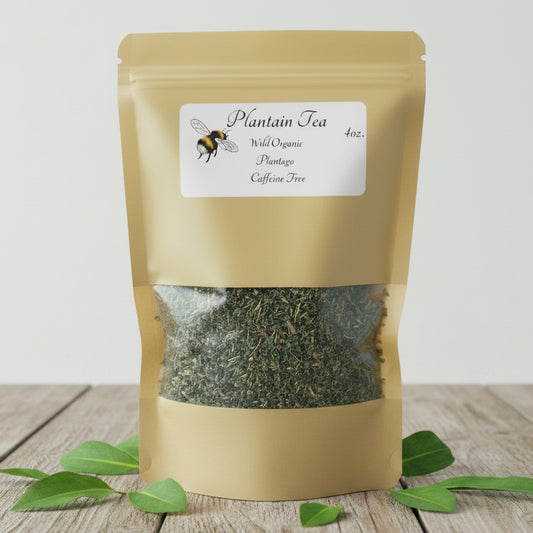 Gold packaging of  Plantain Tea with a bee illustration on a white background