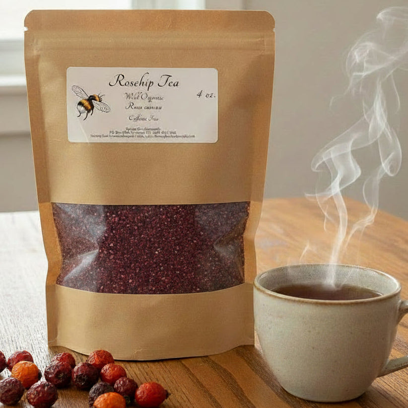 Kraft paper bag of Rosehip Tea on a wooden surface with a laptop in the background.