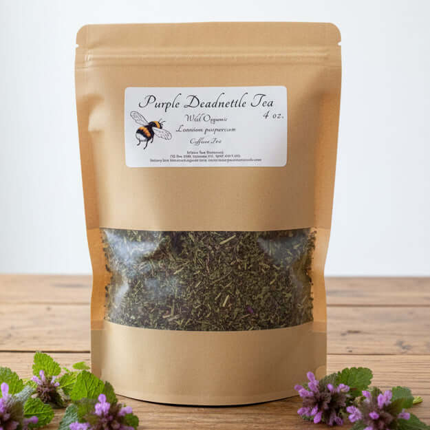 Bag of Purple Deadnettle Tea on a wooden table with a person and cabinet in the background.